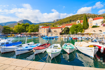 Fototapeta na wymiar Typical colorful fishing boats in Bol port on Brac island, Dalmatia, Croatia