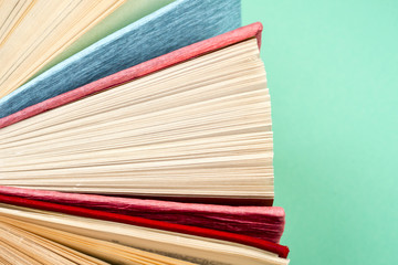 Top view of bright colorful hardback books in a circle.