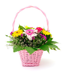 Beautiful bouquet of bright flowers in basket.