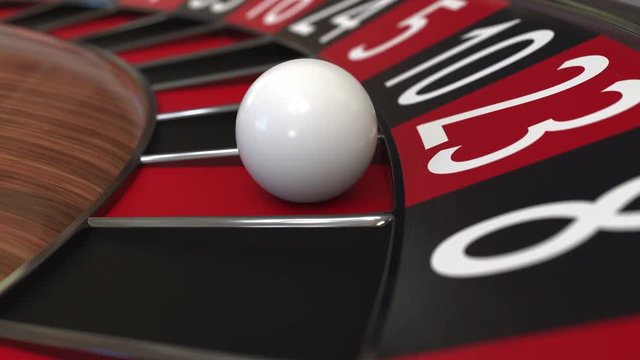 Casino roulette wheel ball hits 23 twenty-three red