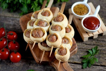 Meatballs baked in puff pastry.