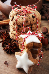 Christmas homemade gingerbread cookies star shaped on wooden table.