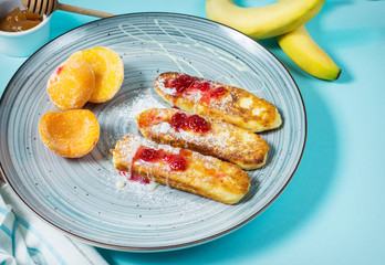Cottage cheese pancakes with oats, syrniki and peach on blue background
