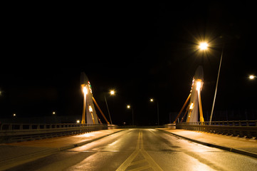 Fototapeta na wymiar Modern bridge over street at night in Gdansk in Poland.