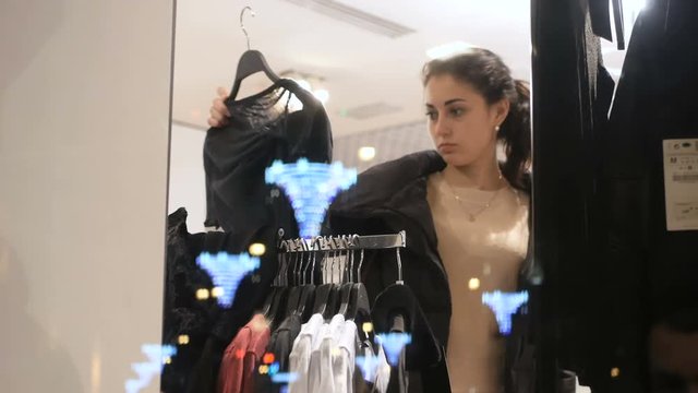 Woman looking at clothes in clothing store