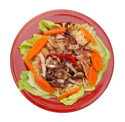 Pasta with seafood: octopus, squid  decorated with chili and carrot, salad