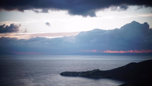 Greek coastline at early morning after sunrise with dark stormy clouds, Greece Peloponnese Mani. Time lapse 4K