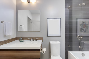 Fototapeta na wymiar Designer Bathroom with Glass Shower and wooden cabinet