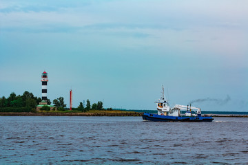 Blue tug ship underway
