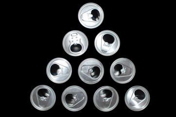 ten tin cans on a black background