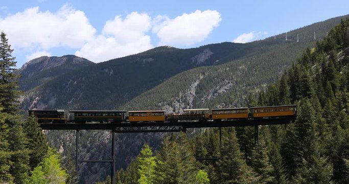 Georgetown Colorado historic tourist railroad high bridge part 2. Silver and gold mining camp Rocky Mountains established in 1859. Historical summer tourist center.  Narrow gauge heritage train.