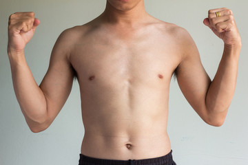 skinny boy on gray background