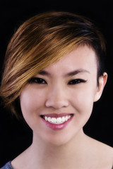 Fototapeta premium Smiling Portrait Asian American Woman Short Hair