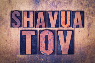 Shavua Tov Theme Letterpress Word on Wood Background