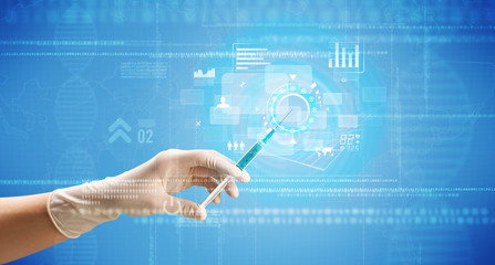 Female doctor holding syringe