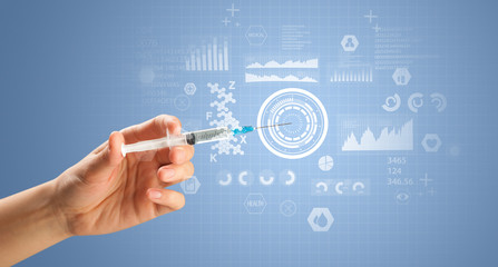 Female doctor holding syringe