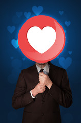 Businessman holding heart sign