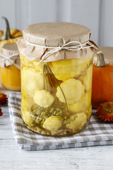Pattypan squash in glass jar