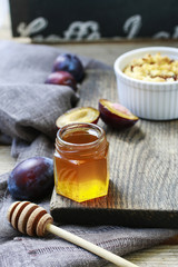 Jar of honey and plums