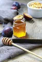 Jar of honey and plums