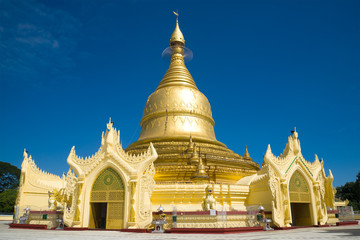 Fototapeta premium Buddhist temple of Maha Wizaya Pagoda close up in the sunny day. Yangon, Myanmar