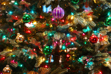 Fototapeta na wymiar Close up on the decorated Christmas tree in the house