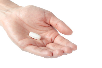 pills in woman hand