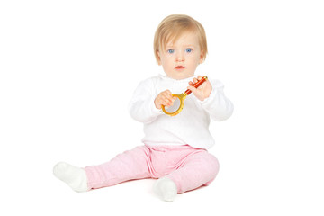 Caucasian baby girl holding magnifying glass isolated on white background