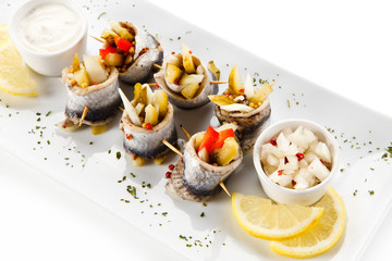 Marinated herring fillets on white background 