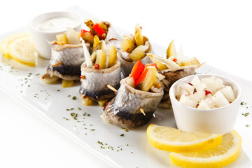 Marinated herring fillets on white background 