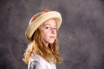 blond girl in white dress and straw hat