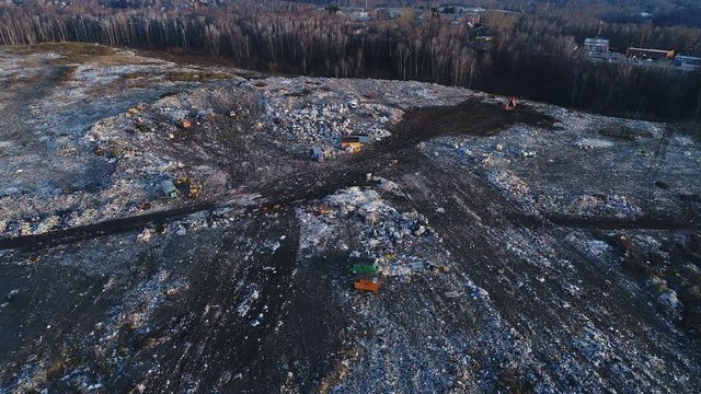 Aero Scene Of Waste Burial. The Gulls Fly Overhead Of Contamination City Land By Household Domestic Stuff From Non-recyclable Plastic And Paper Background. Environmental Problem Of Despair Cityscape