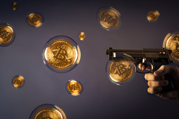 many bitcoin bubbles and a gun pointing at one bubble