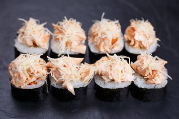 Luxury restaurant sushi menu. Sushi rolls decorated with chicken and parmesan cheese. Food art, Japanese meals
