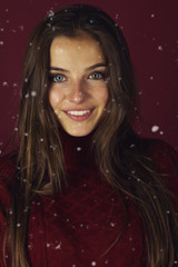 Amazing teen girl posing on a red background , winter style model