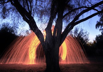 Flying sparks created with steel wool photography. 