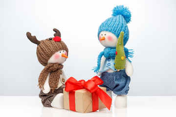 Merry Christmas and Happy New year, winter concept. Snowmen and gift.