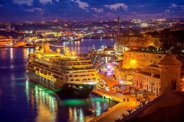 Fototapeta na wymiar aerial view of cruise ship in Grand Harbour in night, Valletta, Malta