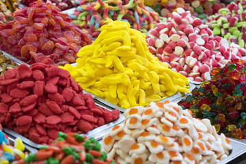 Assortment of jellied colored sweets as a product background