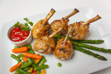 chicken legs with asparagus and ketchup