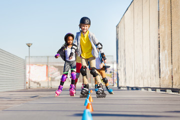 Happy inline skaters rolling at skate park © Sergey Novikov