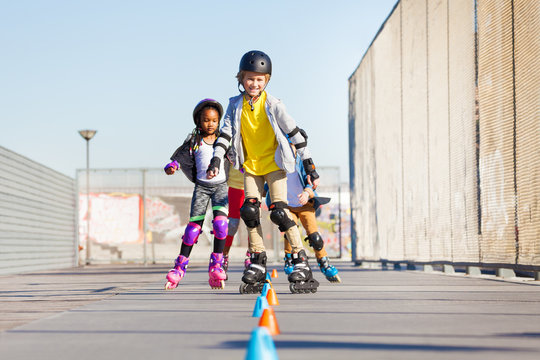 Happy inline skaters rolling at skate park