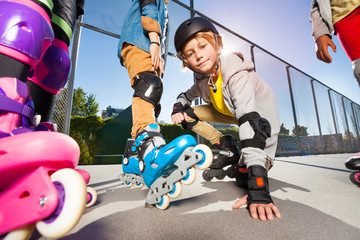 Preteen boy on roller skates at outdoor stadium