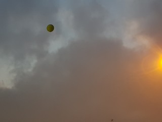 sun and clouds and hot air balloon