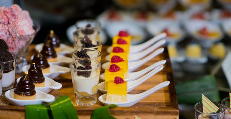 Glass shots  pastry. wedding catering food. mini canapes food.  tasty dessert. Beautiful decorate catering banquet table.  snacks and appetizers. wedding celebration