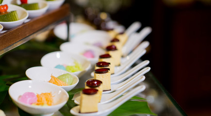Glass shots  pastry. wedding catering food. mini canapes food.  tasty dessert. Beautiful decorate catering banquet table.  snacks and appetizers. wedding celebration