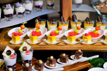 Glass shots  pastry. wedding catering food. mini canapes food.  tasty dessert. Beautiful decorate catering banquet table.  snacks and appetizers. wedding celebration