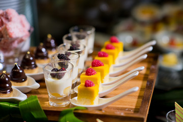 Glass shots  pastry. wedding catering food. mini canapes food.  tasty dessert. Beautiful decorate catering banquet table.  snacks and appetizers. wedding celebration