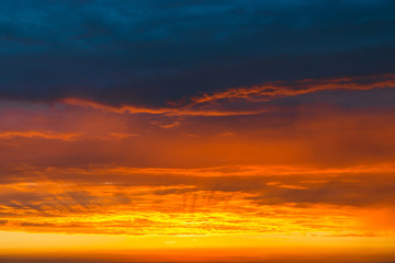 dramatic vibrant colorful clouds during sunset