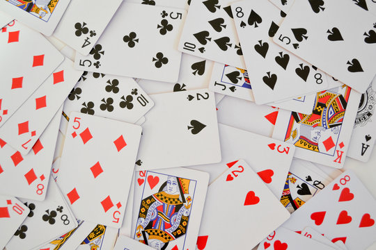 Poker background of scattered playing cards